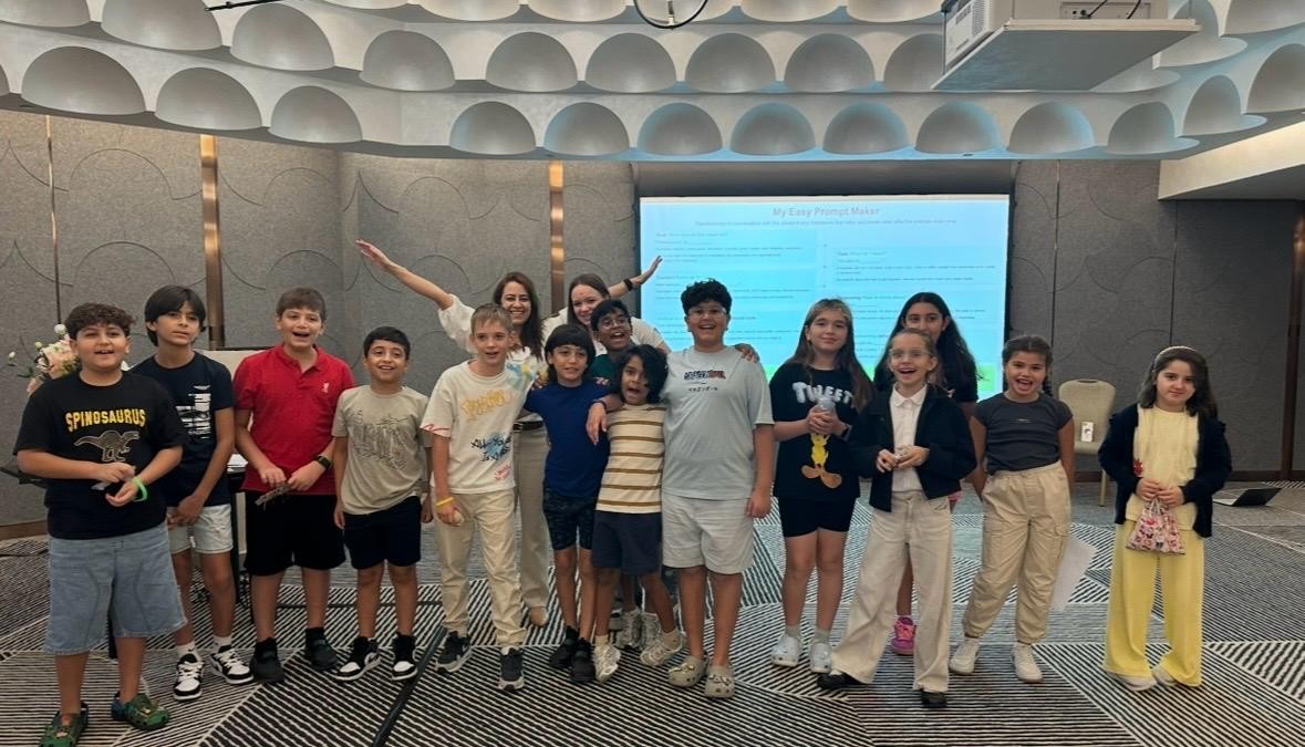 Transformation Avenue founder celebrating with a big group of happy kids at a Dubai workshop